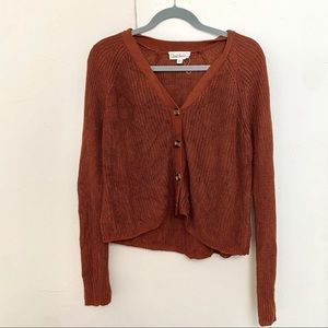 Burnt orange cropped cardigan. Size: x-large
